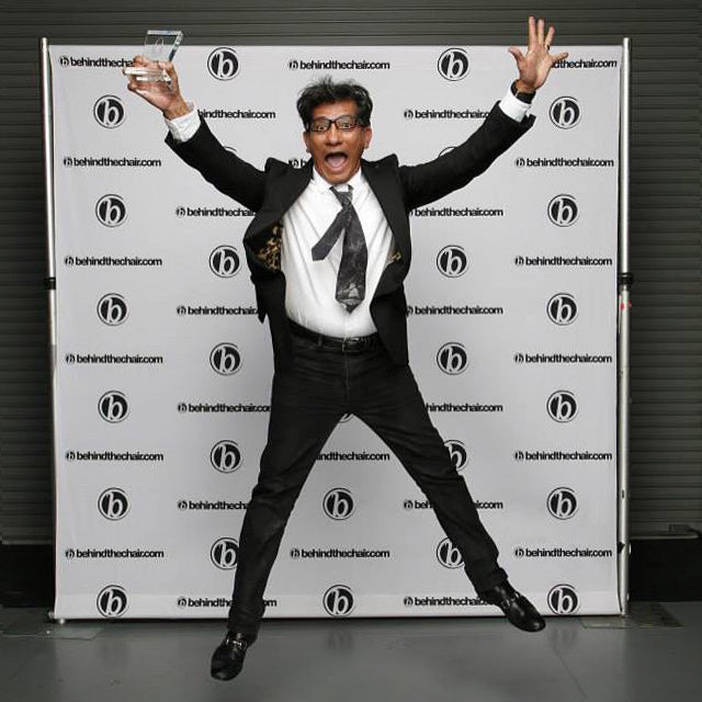 Shot of Sam Villa jumping for joy after winning the 4th SCA Favorite Educator Award