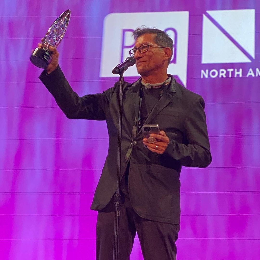 Sam Villa accepting an award.
