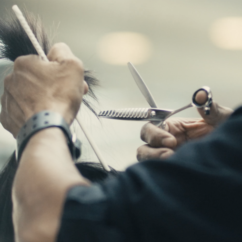 Sam Villa InvisiBlend Thinning Shear featuring 23 ultra-fine teeth for invisible blending and soft texture, that leaves no blunt lines, with ergonomic handle and Japanese stainless steel construction.