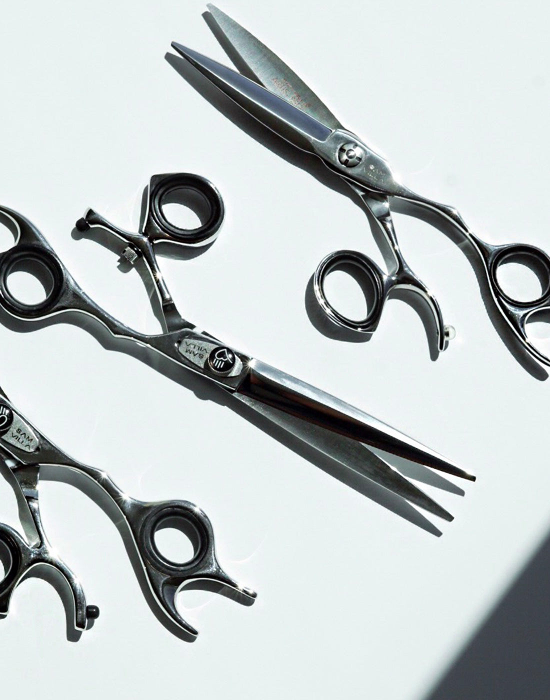 Three Sam Villa Shears laid onto white surface