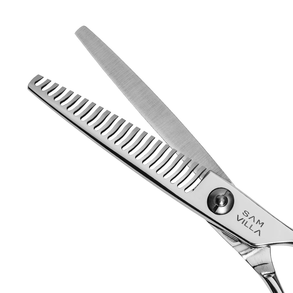 Sam Villa InvisiBlend Thinning Shear featuring 23 ultra-fine teeth for invisible blending and soft texture, that leaves no blunt lines, with ergonomic handle and Japanese stainless steel construction.