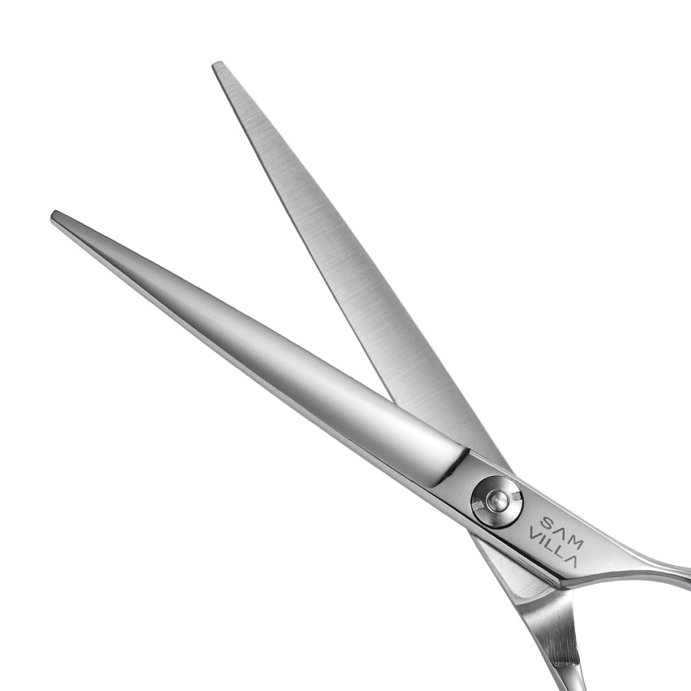 Sam Villa Essential Series Shear with ergonomic forward-set handle, convex blades, and Japanese stainless steel for smooth, comfortable wet or dry hair cutting.