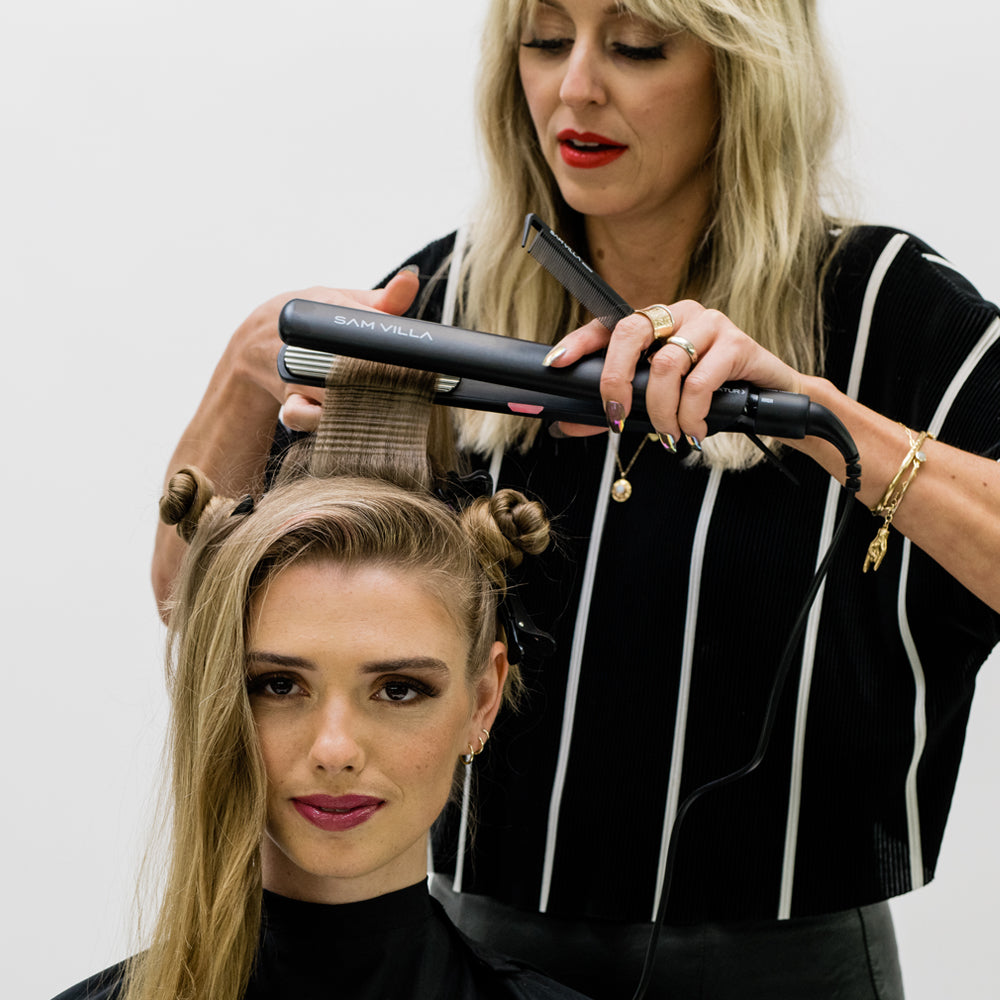 Stylist Anna Peters creating volume and texture at the roots with the Sam Villa Textur Iron, mini hair crimper.