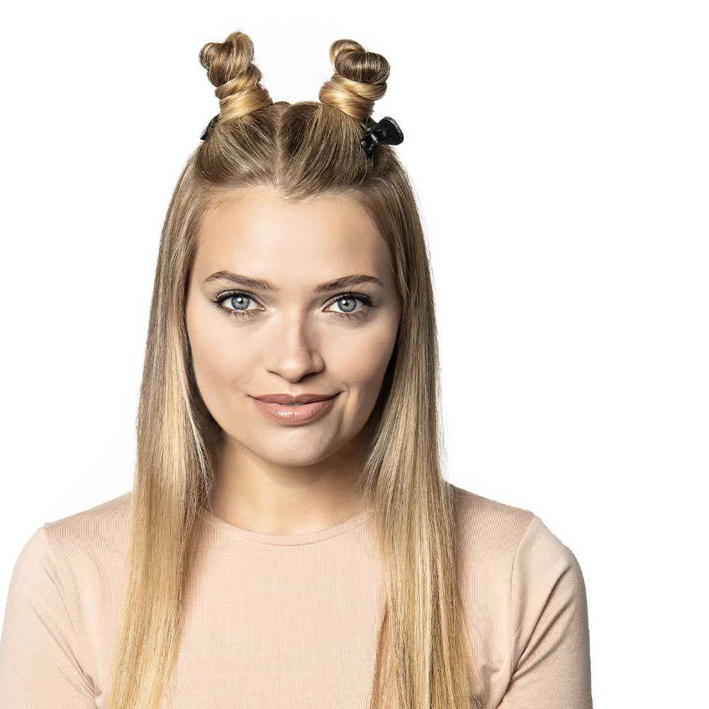 Blonde model with two top knots sectioned off with Sam Villa Dry Sectioning Clips