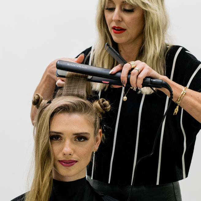 Stylist Anna Peters creating volume and texture at the roots with the Sam Villa Textur Iron, mini hair crimper.